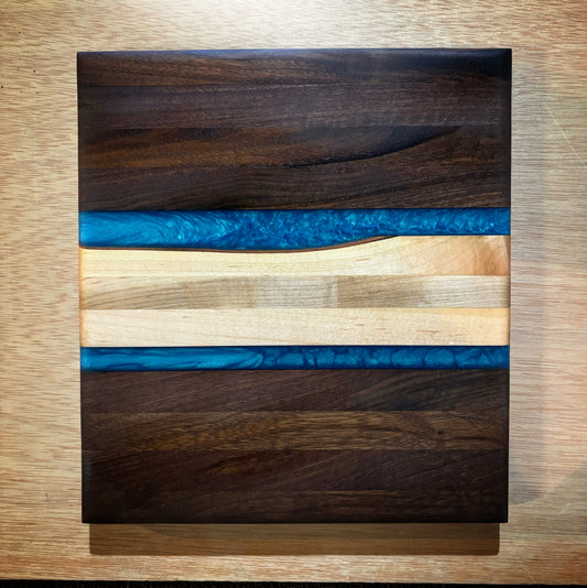 Handcrafted Walnut & Maple Cutting Board with Turquoise Epoxy Inlay